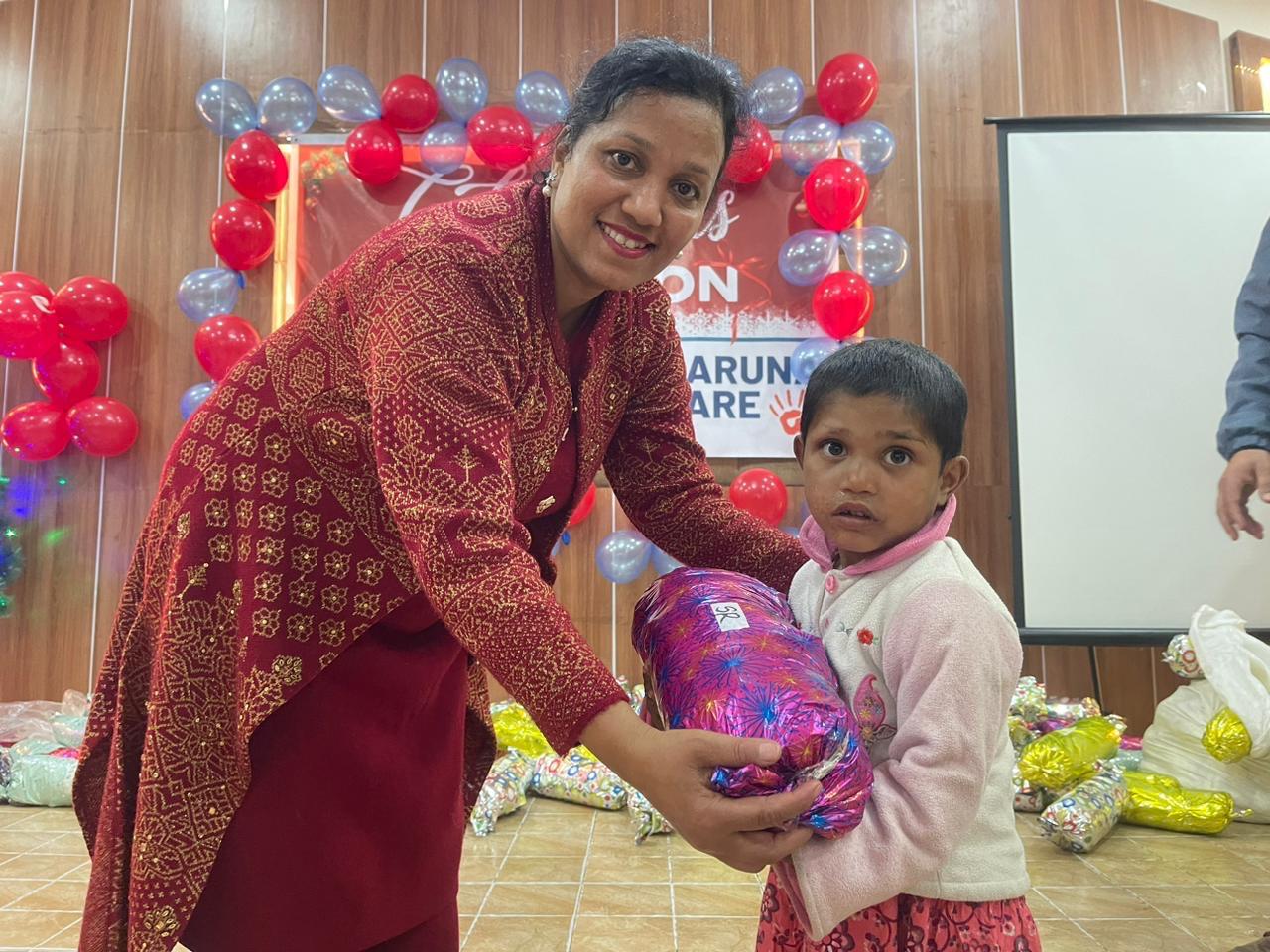 SG handing gift