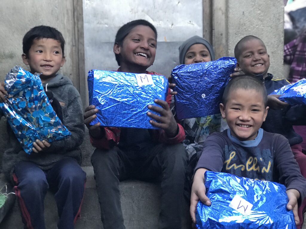 balkhu kids holding blue gifts